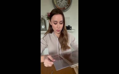 Una Healy unboxes Taylor Swift vinyl.