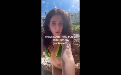 Mae Muller bikini beach tease.
