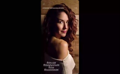 Erin Karpluk off-shoulder sweater tease.