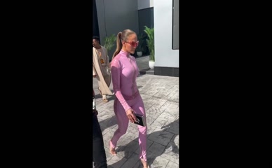 JLo Pink Latex Catsuit Ass View