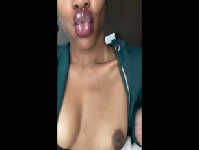 Mahoganimoet topless blowing smoke.