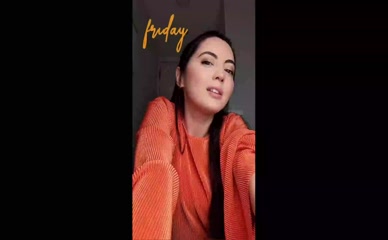 Jane Douglas cleavage tease orange top