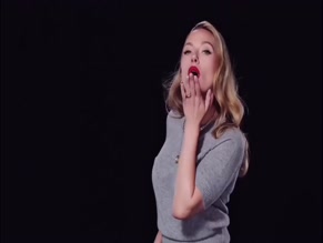Scarlett Johansson in grey sweater and trousers