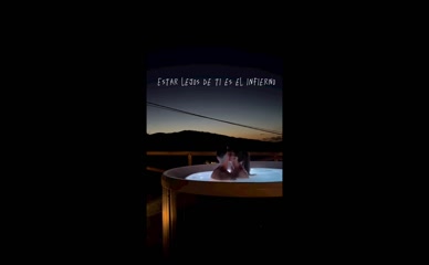 Rosario Matew and partner kissing in hot tub