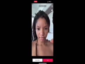 Halle Bailey topless photobomb