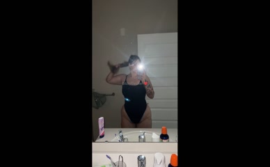 glizzycatcher in black one-piece swimsuit mirror selfie