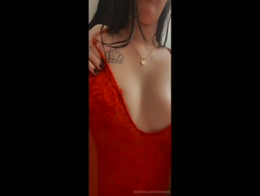 Ririmariiee's bare breasts in red lingerie