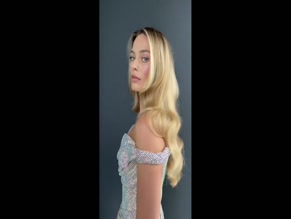 Margot Robbie cleavage dress.