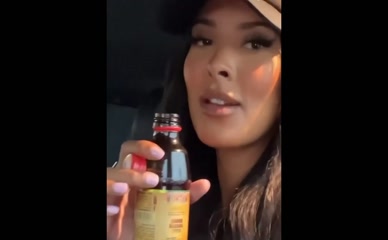 Maya Jama drinking in car