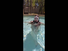 sexynursejennfree in red bikini top and black scuba gear surfacing in pool