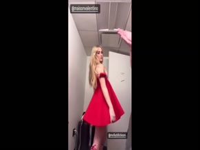 Kathryn Newton red dress cleavage tease