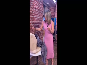 Ginger Zee in tight pink ribbed clothing emphasizing curves