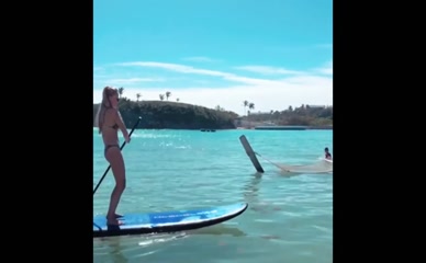 Olivia Harlan Dekker bikini paddleboarding.
