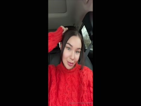 margomargarita selfie in car, red sweater