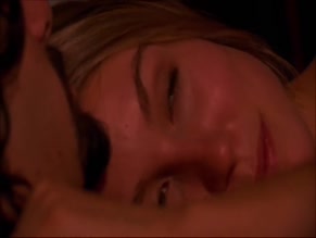 Sarah Carter topless in bed.