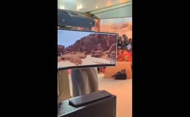 Jane Douglas plays a video game.