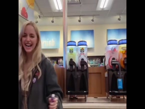 Mckenna Grace drinks shot with friend in store