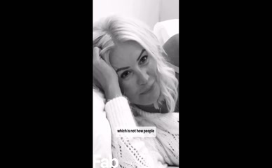 Denise Van Outen exposes breasts in translucent top.