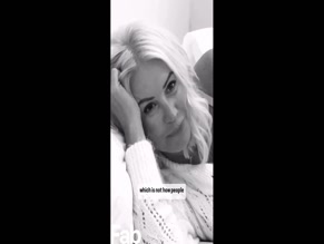 Denise Van Outen exposes breasts in translucent top.