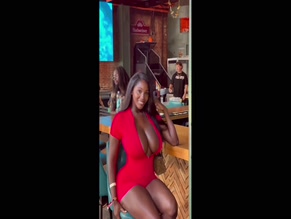 Ellie The Empress showing her big cleavage in a red dress