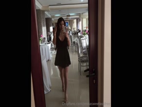 b'' in sheer black dress takes mirror selfie
