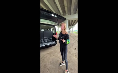 Lisarulit struggles with heavy car trunk.