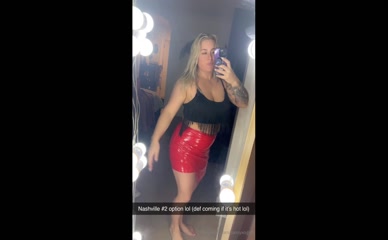 Sassyxogiirl in red vinyl mini skirt.