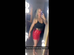 Sassyxogiirl in red vinyl mini skirt.