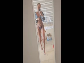 Aisleyne Horgan-Wallace in Union Jack thong and denim jacket mirror selfie