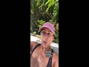 Saira Khan00:00: Woman in black mesh swim top with visible cleavage