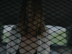 Emma Lahana topless in cop car.