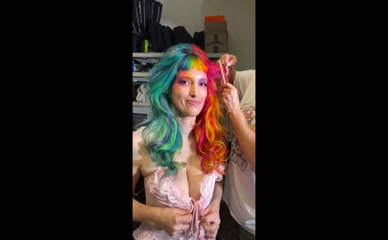 Dani Thorne half-rainbow hair cleavage tease