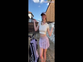 Golfgirl Grace Charis flashes her tits with a golf club.