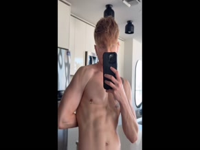 nokus Shirtless male exposing chest and pierced nipple.