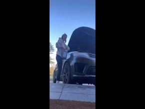 Frankie Bridge adds windshield washer fluid to car