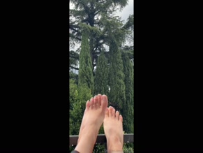 ririofficial's bare feet in the rain