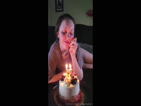 b'' celebrates birthday with cake and candles