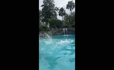 Jenna Citrus dives into pool, bikini.