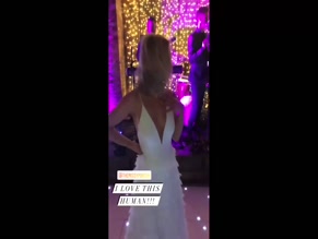 Jorgie Porter dancing in white dress.
