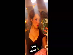 Elizabeth Gillies cleavage visible