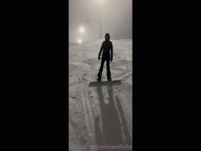 rainbowedfoxfree snowboarding on a snowy mountain at night