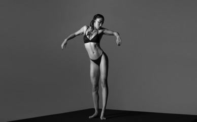 FKA Twigs: Female in bra and briefs performs body-focused dance, revealing breasts and buttocks.