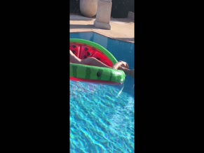 Elizabeth Hurley topless pool float