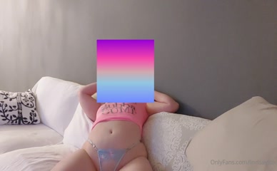 Lindsayfox on the couch in lingerie.