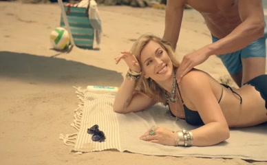 Hilary Duff bare back massage bikini beach.