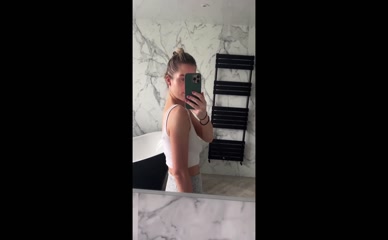 Helen Flanagan braless bathroom selfie.