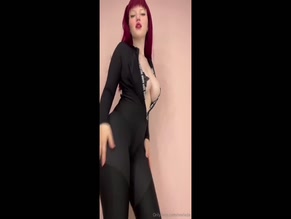 Lada Lyumos dancing in a hot bodysuit showing her cleavage