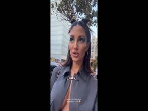 Tania Medina's tits slip out of her open shirt.