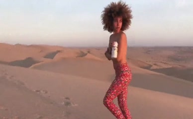 Nude xulanichristine runs in desert, kisses man, drops Modelo beer.