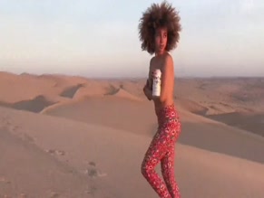 Nude xulanichristine runs in desert, kisses man, drops Modelo beer.